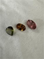 Trio of different color garnets