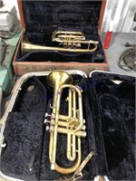 Pair of old trumpets, pieces missing, cases wet