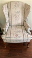 Floral print wing back chair by Elder Beerman