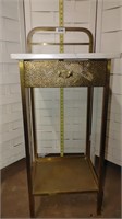 marble and brass nightstand