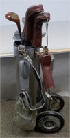 Golf bag clubs and hand cart and accessories.
