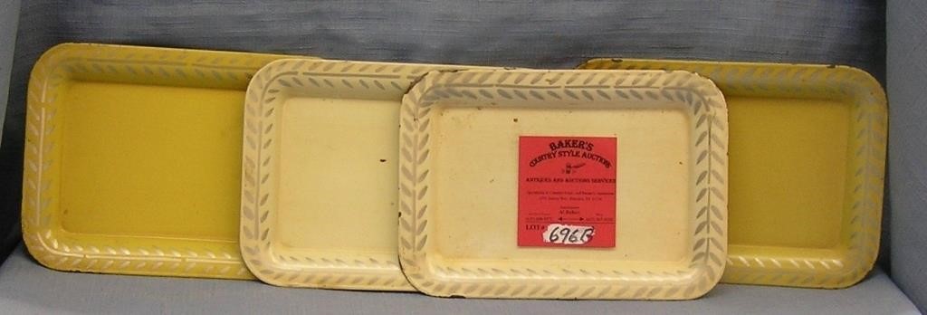Group of four vintage cream colored serving trays