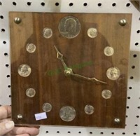Battery operated wall hanging clock with US coin