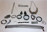 Chain & leather look type jewellery.