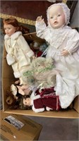 Box lot of over 12 porcelain dolls. (1446)