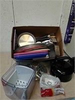 Group of kitchen supplies includes tea kettle,