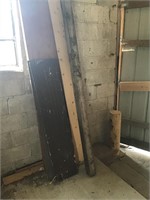 contents along wall - steel pylon, wood, etc