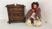 Vintage doll and small jewelry box with some