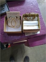 2 pairs of hoop earrings. 
1 pair marked 24