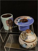 Pottery collection includes flower pot with frog