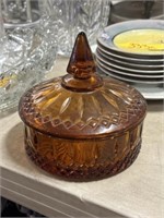 Amber colored glass candy dish with lid