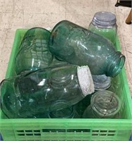 Variety of blue glass ball jars. Some have metal