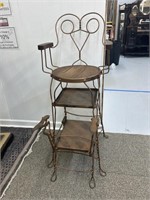 Antique wrought iron shoe shine stand