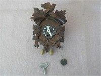 miniature wood and plastic coo-coo clock