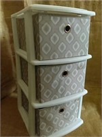 plastic storage container with 3 fabric drawers