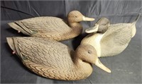 Group of three floating rubber duck decoys