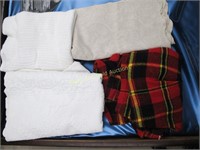 Assortment Of Blankets And Spreads