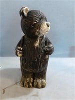 An adorable bear plant holder with something