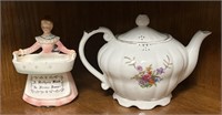 Teapot and porcelain figurine