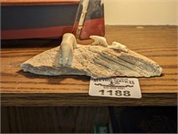 Stone polar bears on whale bone carving