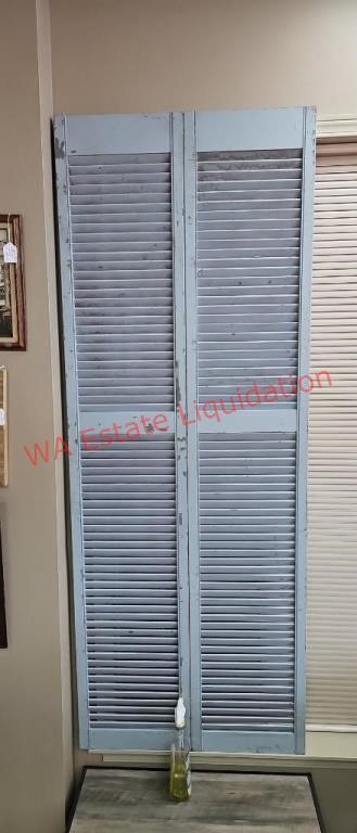 Two Blue Shutters on Wall (front) 
Buyer to