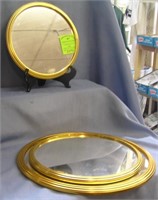 Group of three gold framed vanity framed mirrors