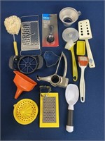 Assorted kitchen utensils including apple slicer,
