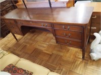R-Way desk with brass-capped feet, three drawers