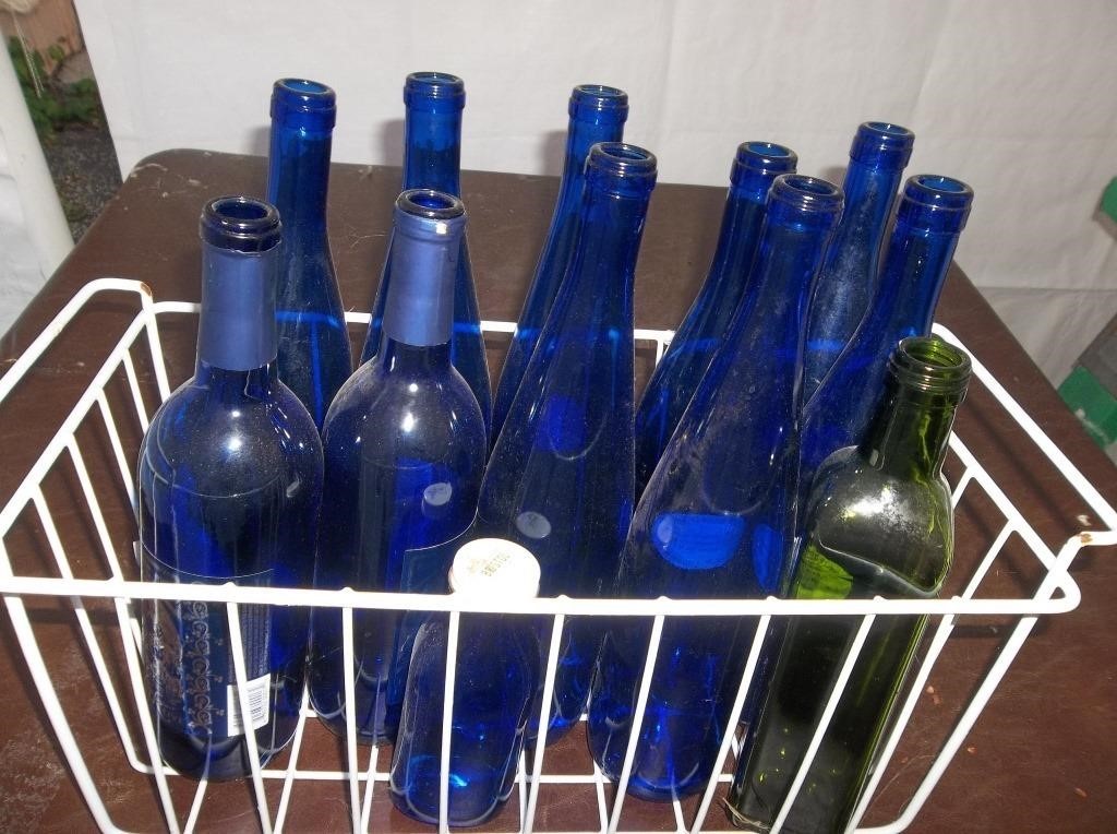 Empty Blue Bottles in Bin