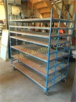 Blue metal shelving rack on wheels