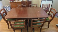 Vintage dining room table with rollers