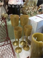 Four piece gold glitter candle holders