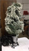 Small-lighted  Christmas tree in planter