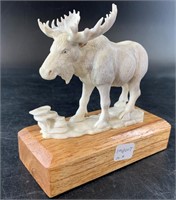 Very detailed antler carving of a bull moose on a