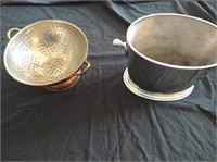 Metal wine chiller and a copper colander