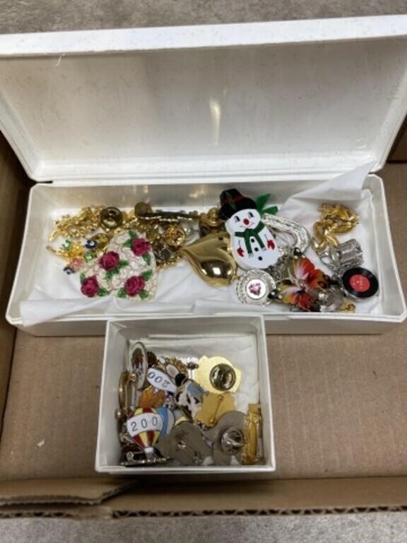 Assortment of pins, brooches, and some jewelry