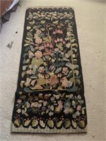 Rug - 2 1/2 feet by 6 feet black rug with flowers