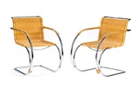 Four Mid Century chrome and wicker armchairs