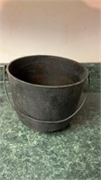 Cast iron cauldron marked L approx 8 in tall 9 in