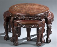 Round Chinese hardwood low table w/nesting chairs.