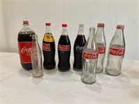 Coca-Cola bottles. 7 glass 1 plastic