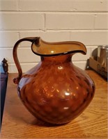 Antique hand blown amber colored glass pitcher