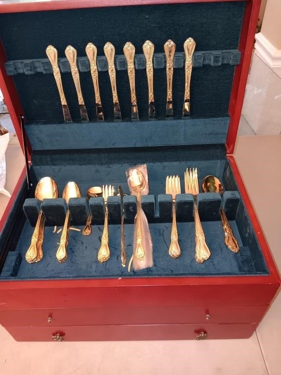 International gold plated flatware in chest 59