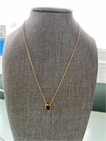 16 inch long goldtone chain with Garnet stone