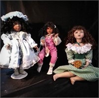 3 collectible dolls, standing doll is a TUSS,