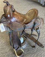 Antique hand, tooled, high back saddle