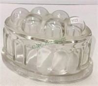 Glass butter mold measuring 3 1/2 inches tall