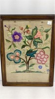 Crewel embroidery flowers, rust on fabric, wood
