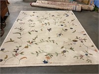 91” by 108” ivory flowered rug
