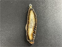 Fossilized ivory cross piece pendant with Alaskan